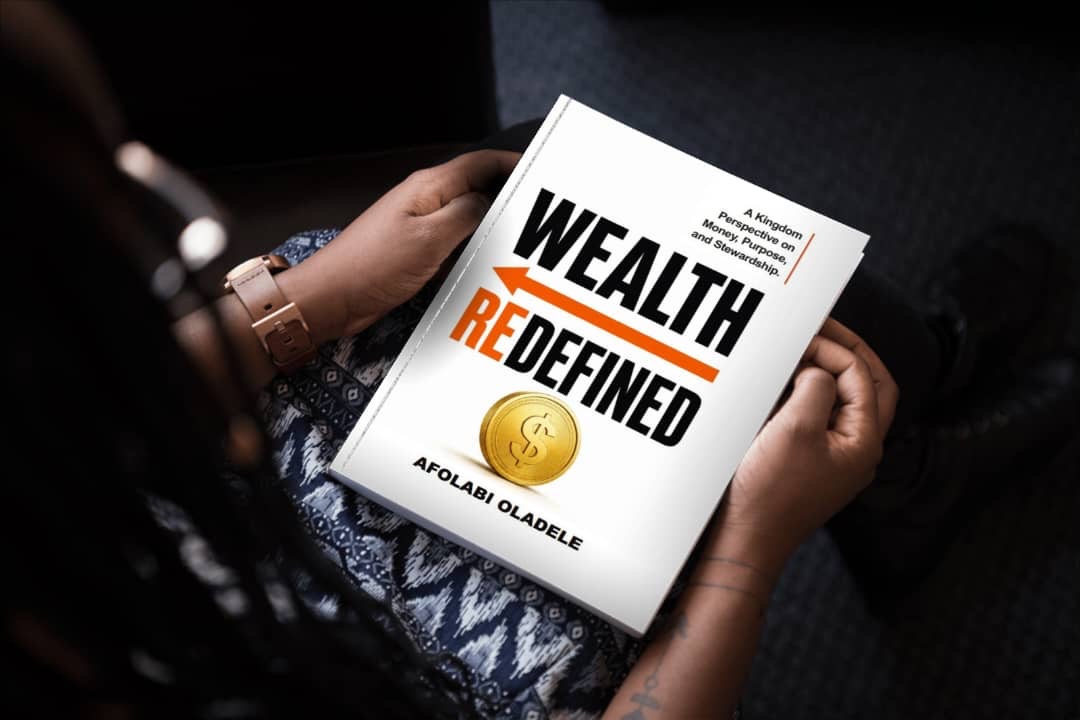 A reader holding Wealth Redefined